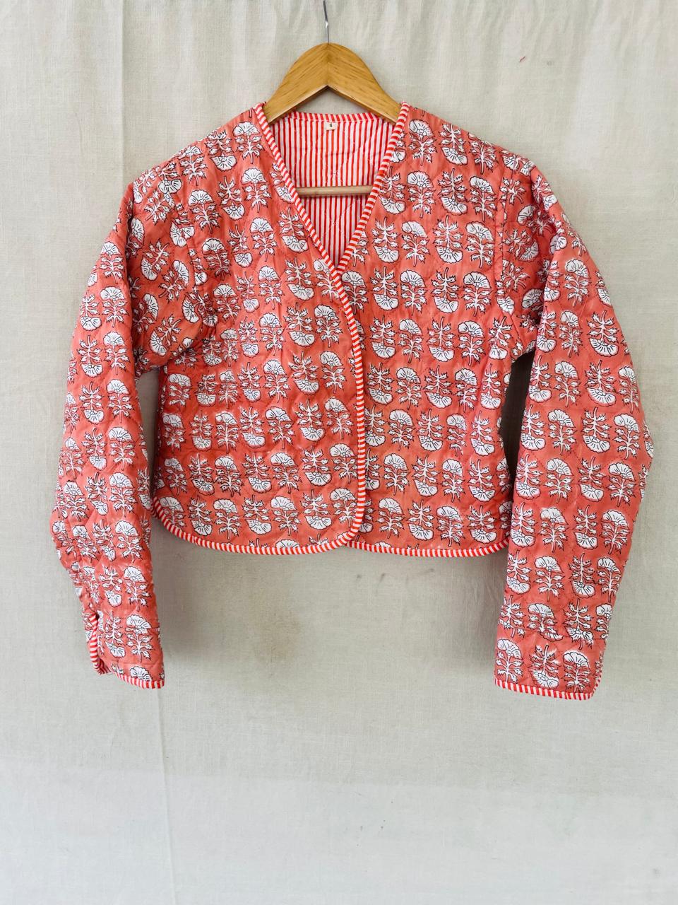 Elephants: a cropped coral quilted jacket with striped edging