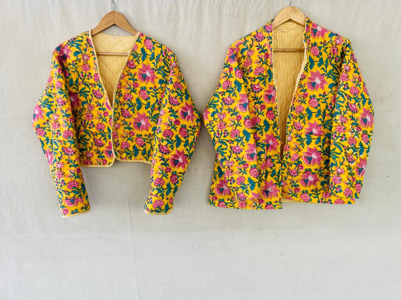 Sunshine: two yellow floral quilted jackets hanging side by side